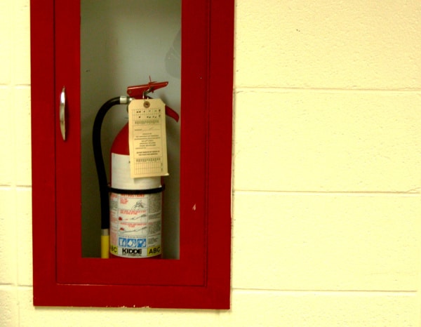 A recessed fire extinguisher cabinet