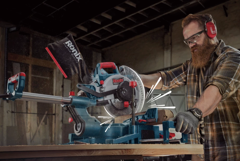 A man cutting through wood with a Ronix miter saw/blade